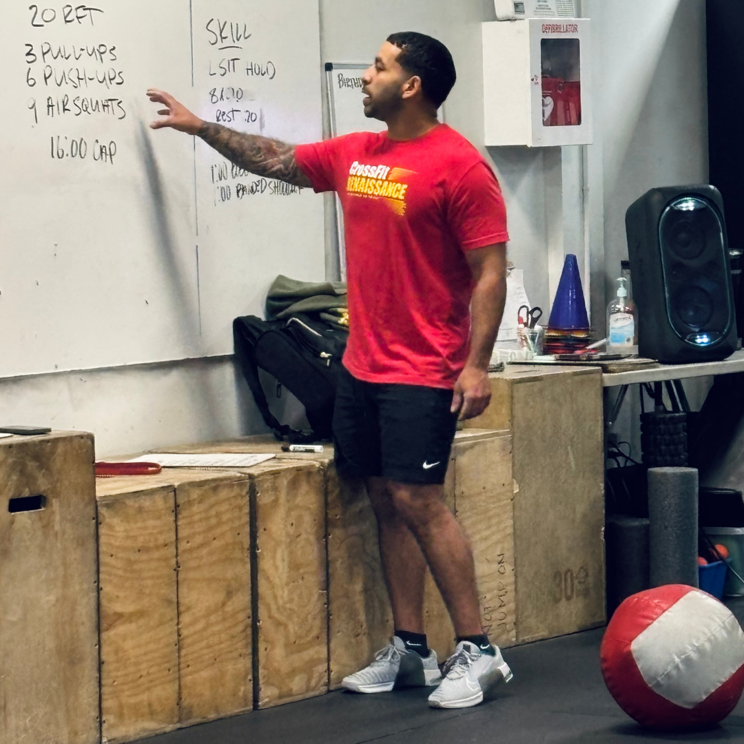 CrossFit Renaissance coach explaining the workout