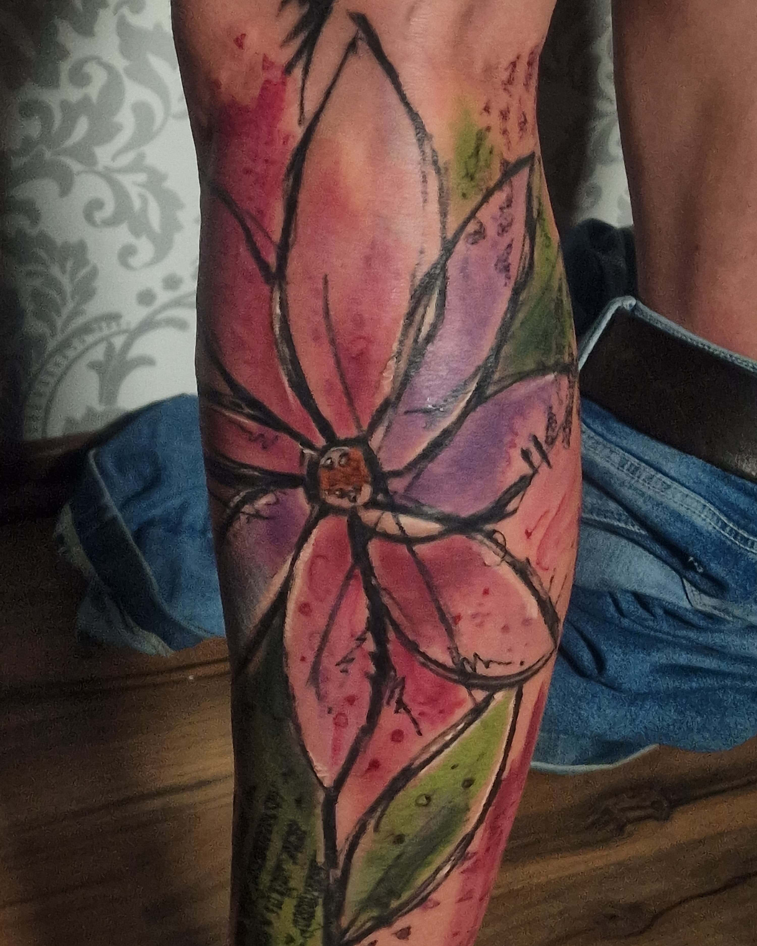 Abstract graffiti-style flower tattoo in bright colors, original artwork by UberDerek