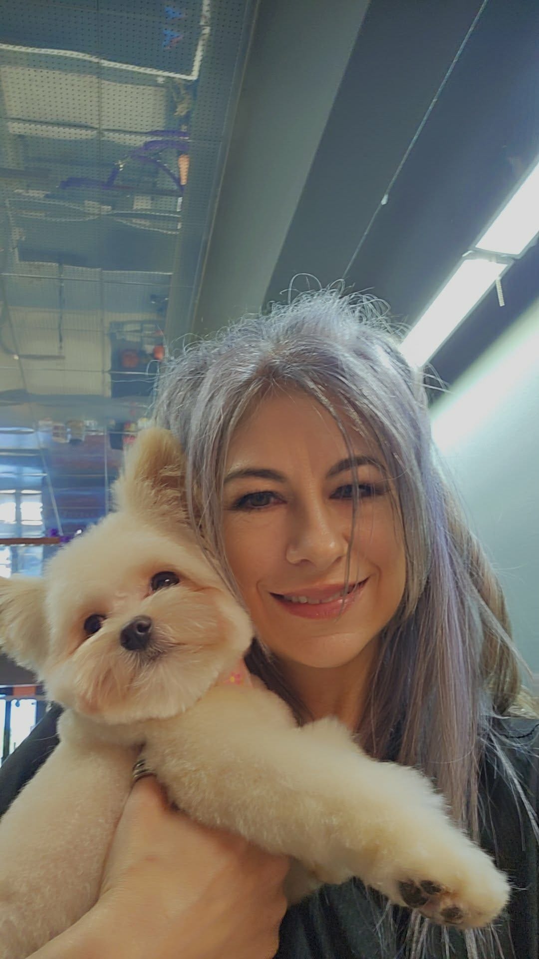 Valerie with a small groomed dog