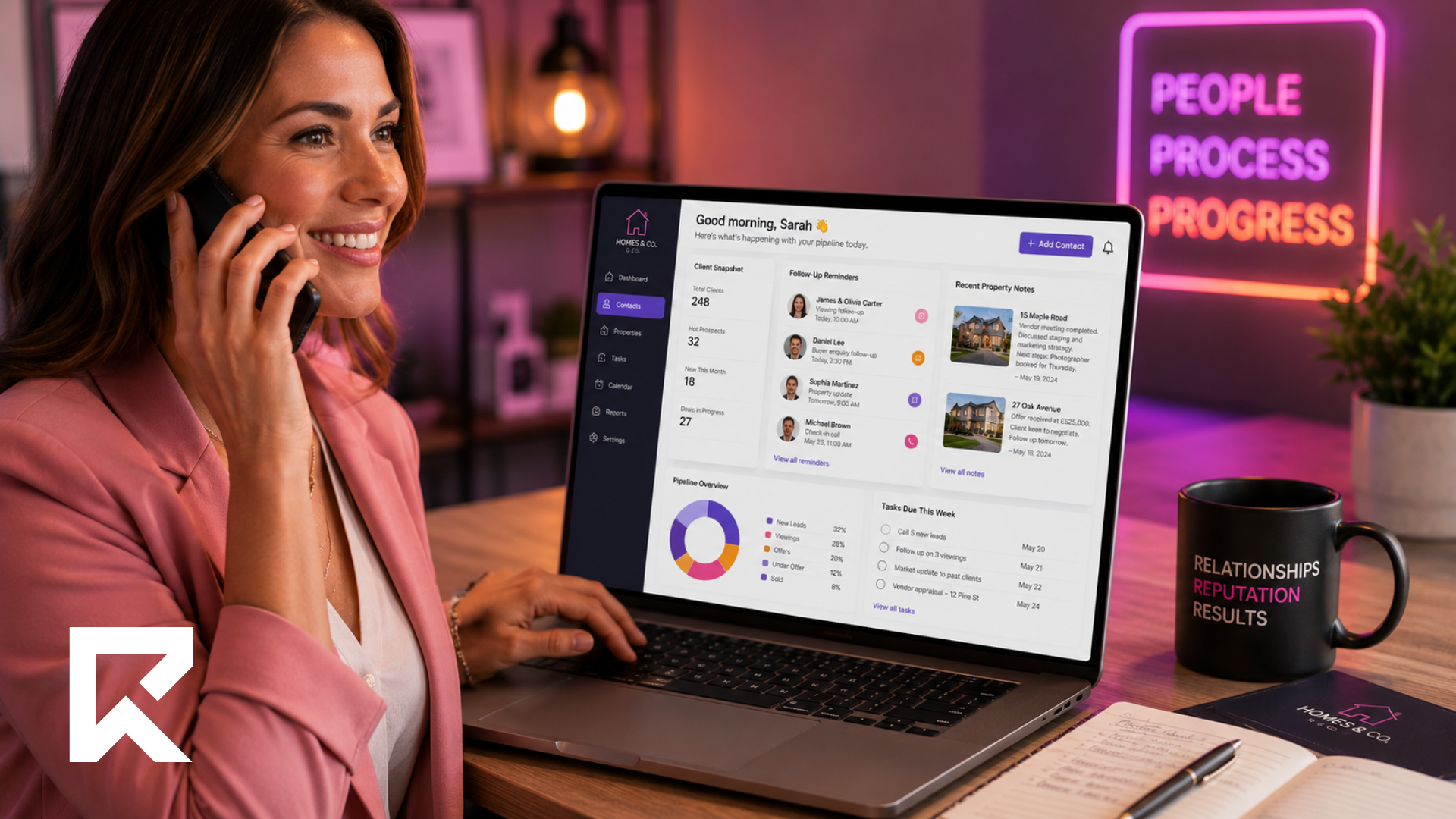 Smiling real estate agent using a CRM dashboard on a laptop to manage contacts, follow-ups, property notes and sales pipeline.