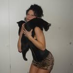 Miss Champion holding a black cat