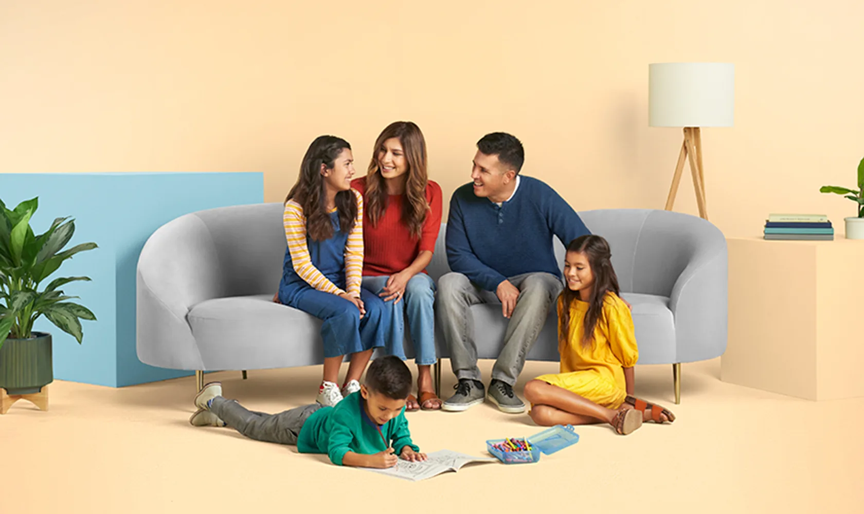 A family of five together in their living room
