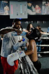 Train Free at GNG GNG Boxing coach mentoring a young fighter in the ring