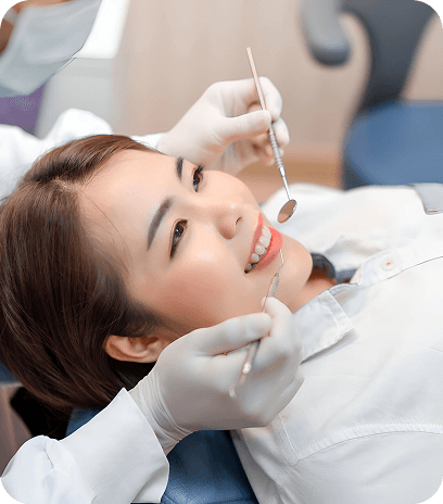 A close up of a fake tooth with glasses on it