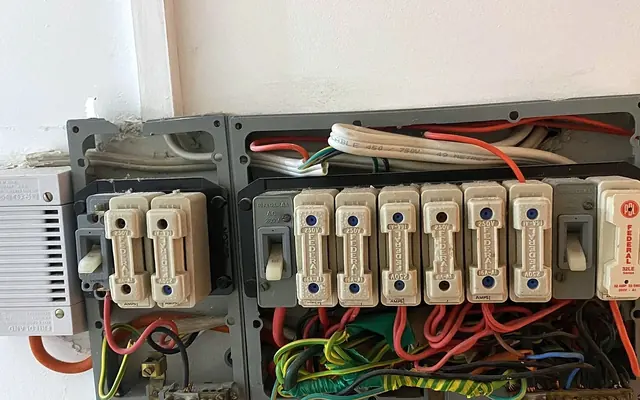 An old switchboard with ceramic fuses