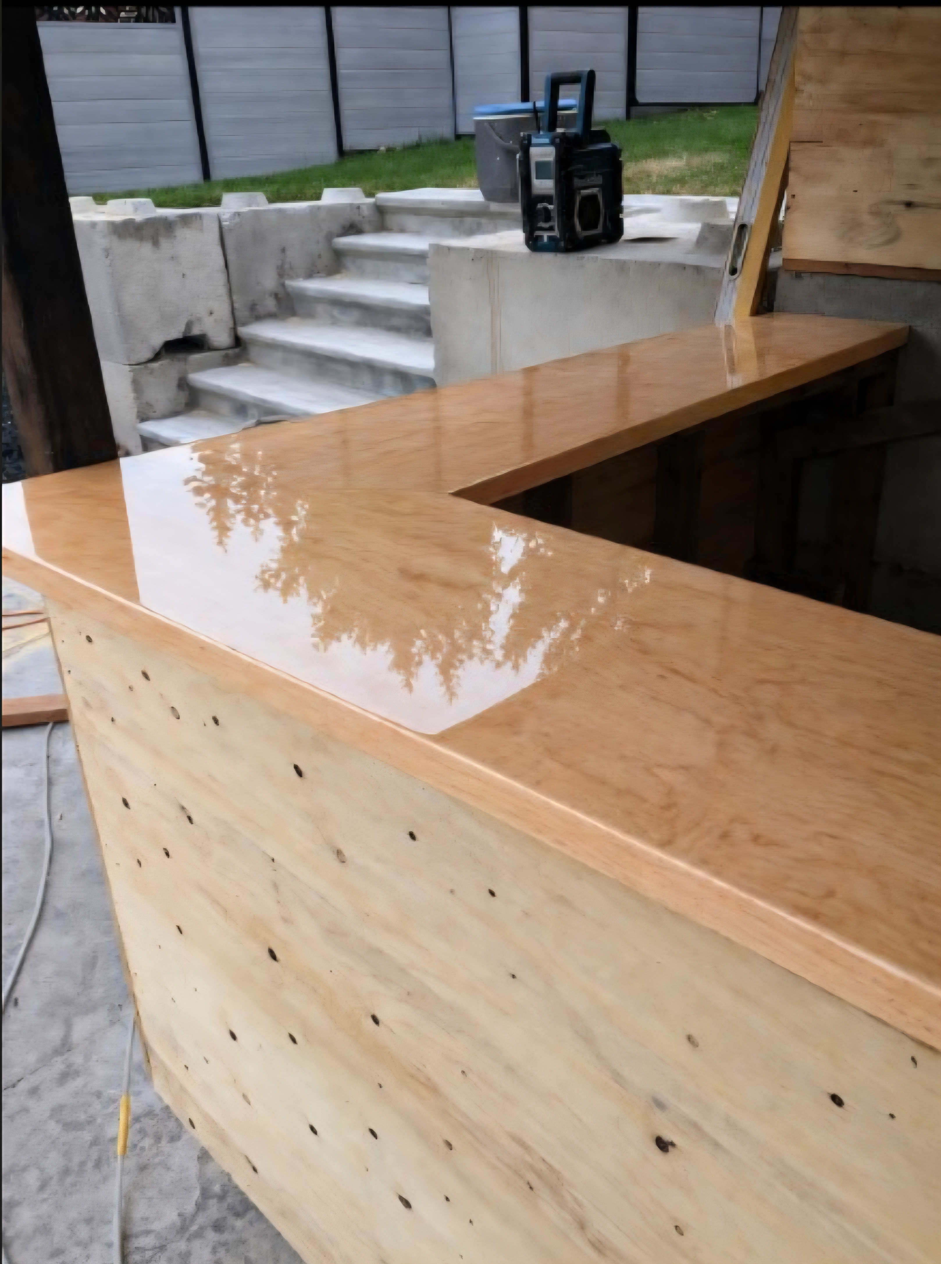 Custom wood and epoxy bar top by Rough Around The Edges