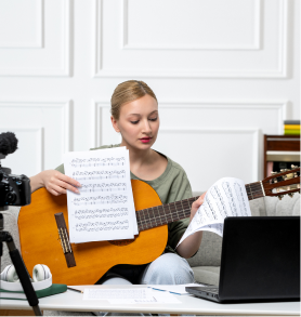 Group of young adults working together on laptops in cafe