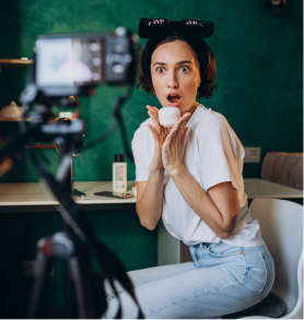 Portrait of woman with camera and hair buns posing