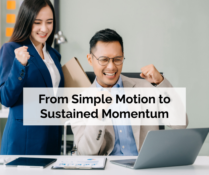 From Simple Motion to Sustained Momentum - business woman and man with fists raised in victory celebration looking at laptop on desk From Simple Motion to Sustained Momentum - business woman and man with fists raised in victory celebration looking at laptop on desk