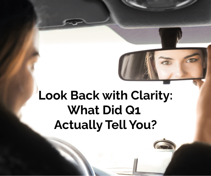 Look Back with Clarity: What Did Q1 Actually Tell You? business woman looking in rearview mirror of a vehicle