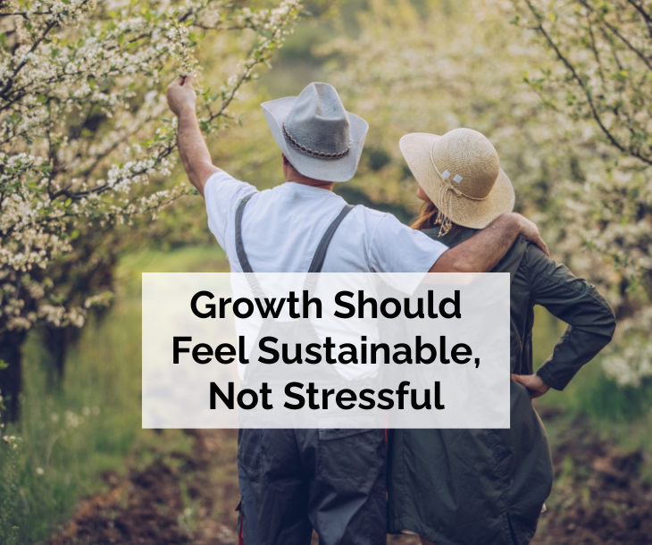 Growth Should Feel Sustainable, Not Stressful - man and woman wearing hats in blossoming orchard