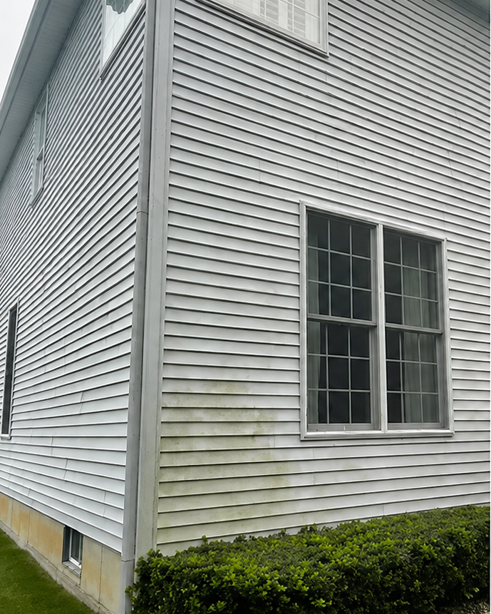 Exterior surface before professional cleaning by Thin Red Line Pressure Washing in Clifton Park, NY.