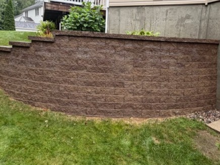 Retaining wall after professional exterior cleaning by Thin Red Line Pressure Washing in Clifton Park, NY.
