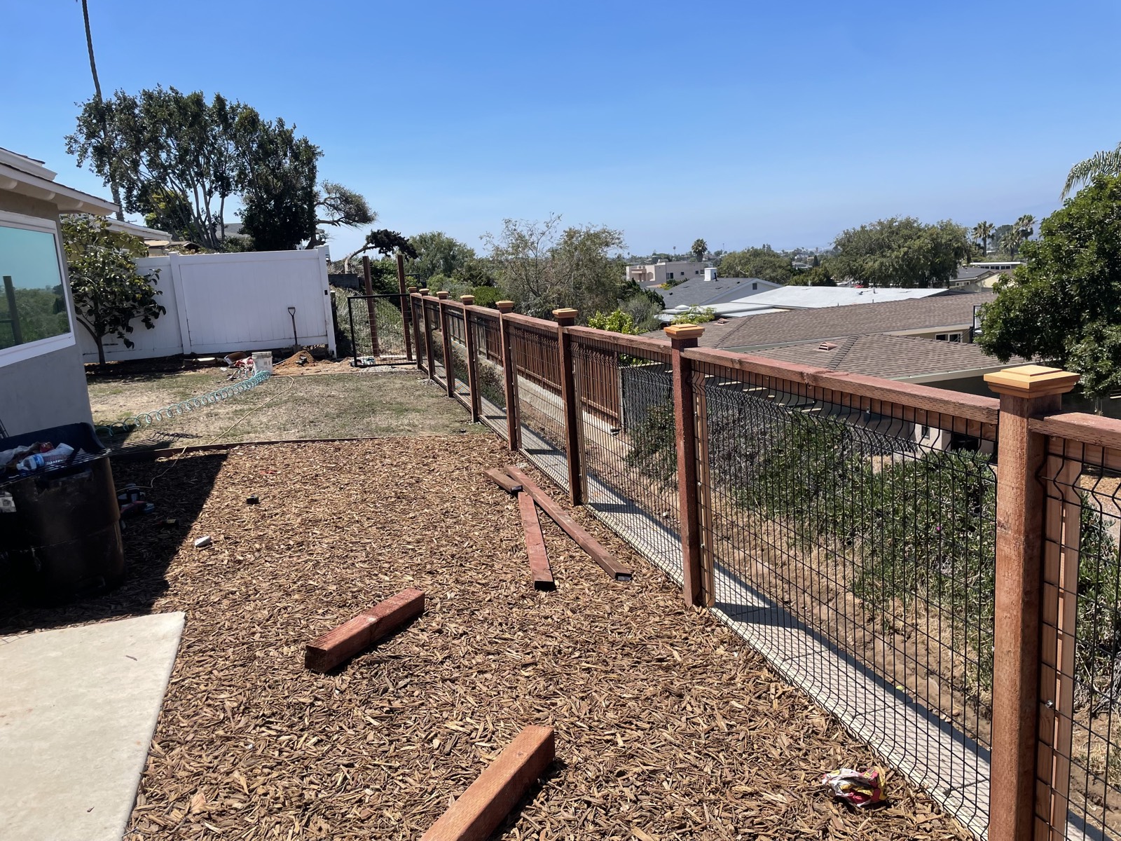 After: finished hillside fence with view