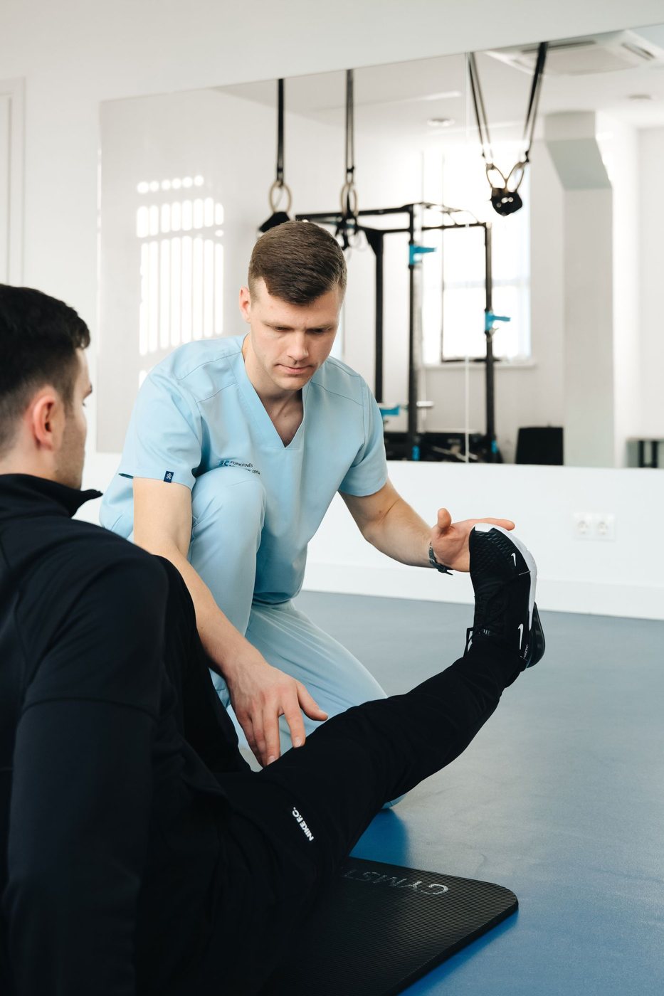 Physiotherapist treating a patient's leg
