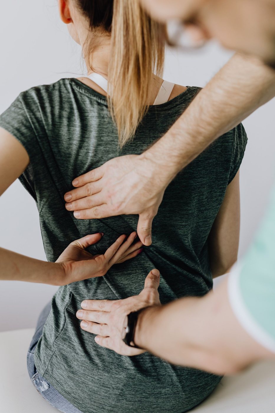 Practitioner treating a patient's back