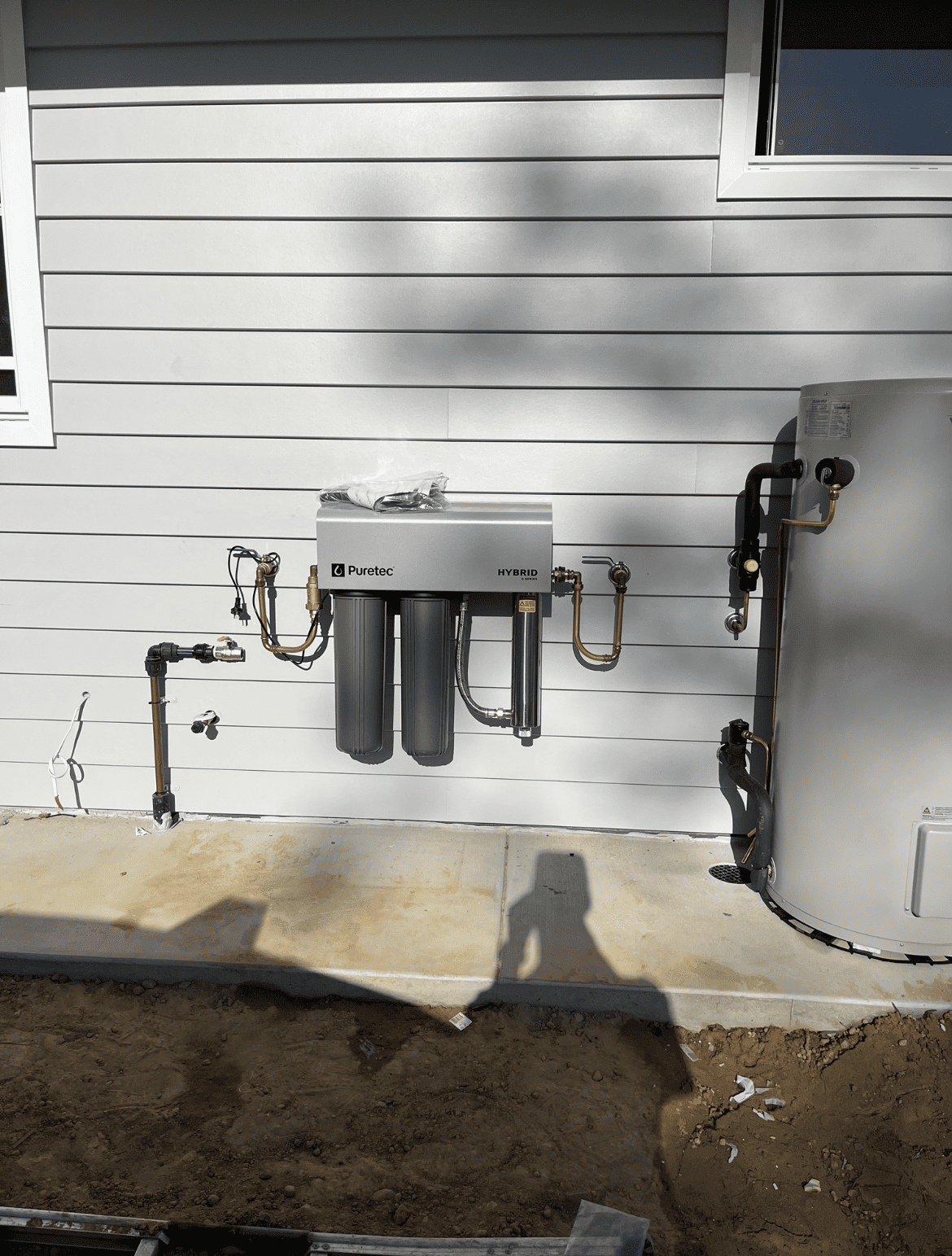 Under-sink water filtration system installed in a Caloundra kitchen cabinet