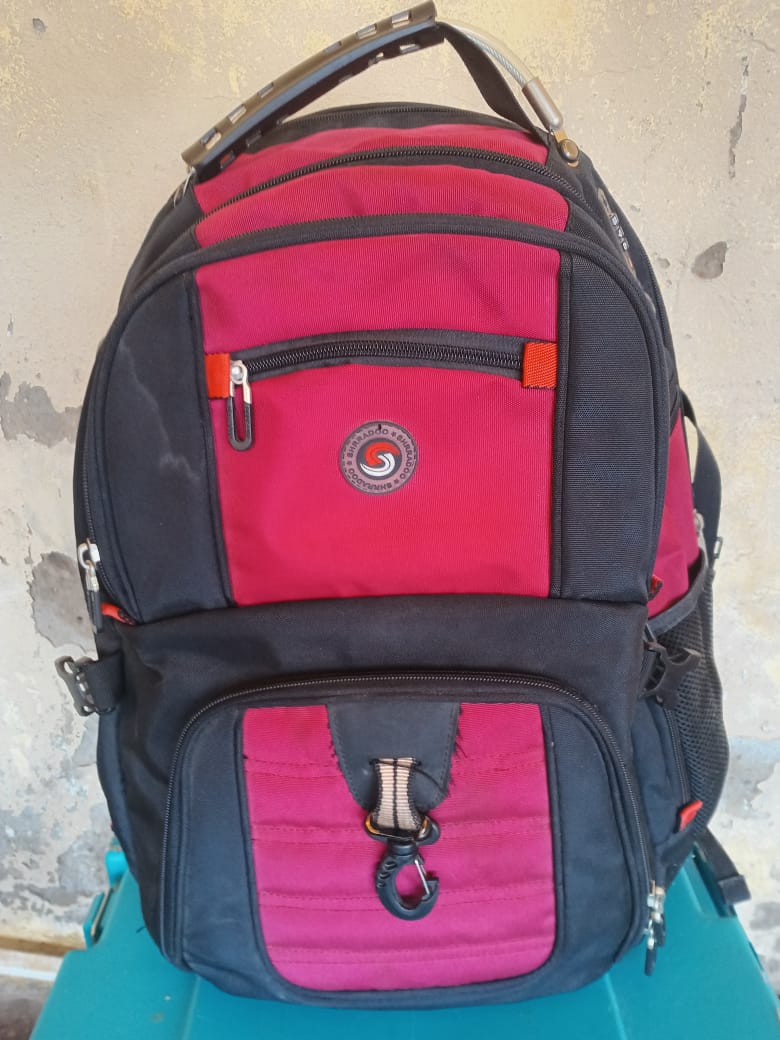Red and black Swiss Army backpack used for travel and mission trips Red and black Swiss Army backpack used for travel and mission trips