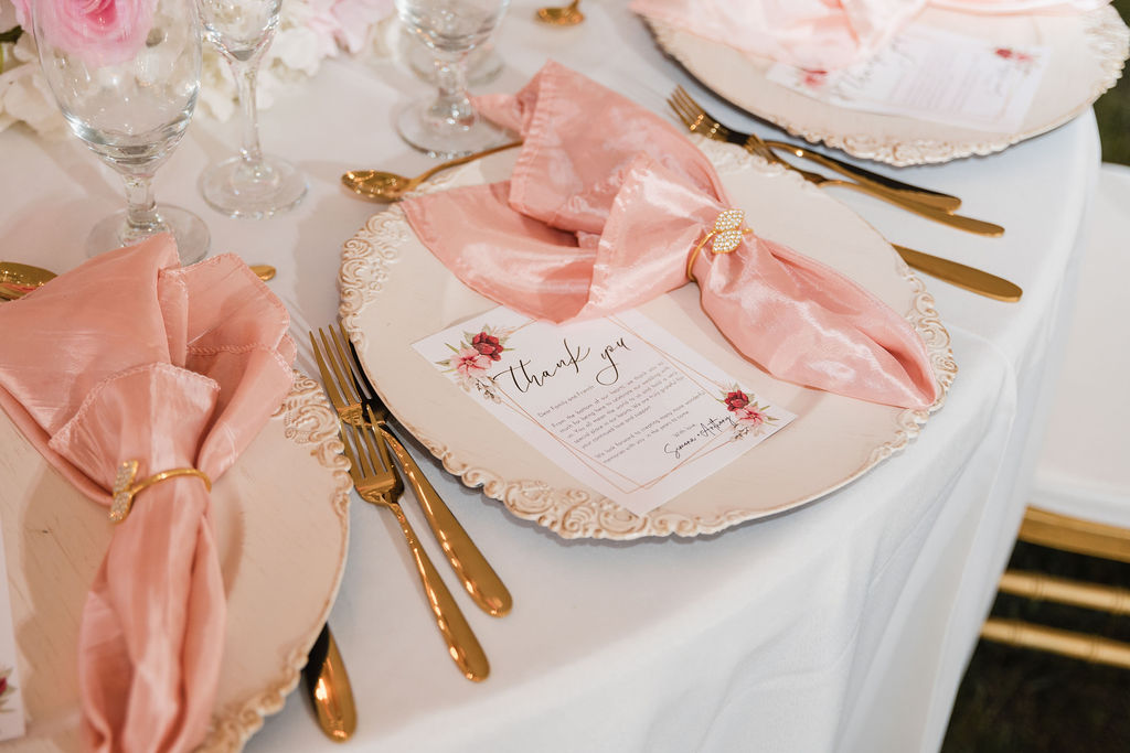 Blush pink napkin with a rhinestone gold ring and cream charger by MJ Event Designs