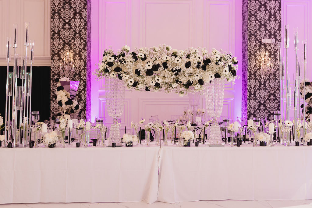 Black and white floral crystal centerpiece on a long table by MJ Event Designs