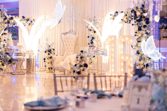 Sweet 16 stage with butterfly lights, a tufted throne and illuminated 16 by MJ Event Designs