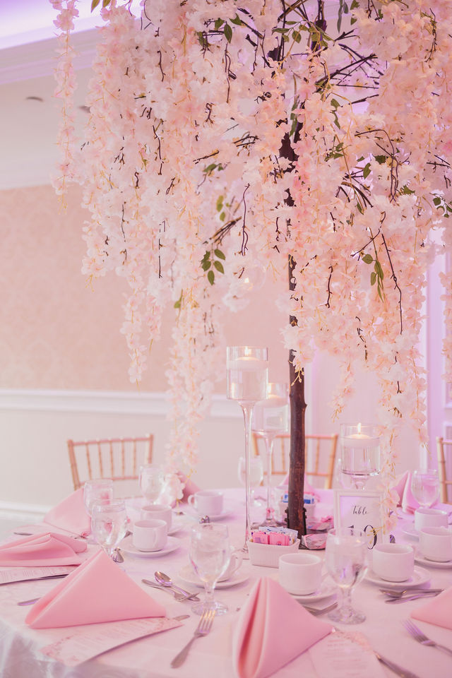 Pink and white hanging floral centerpiece on a round table by MJ Event Designs