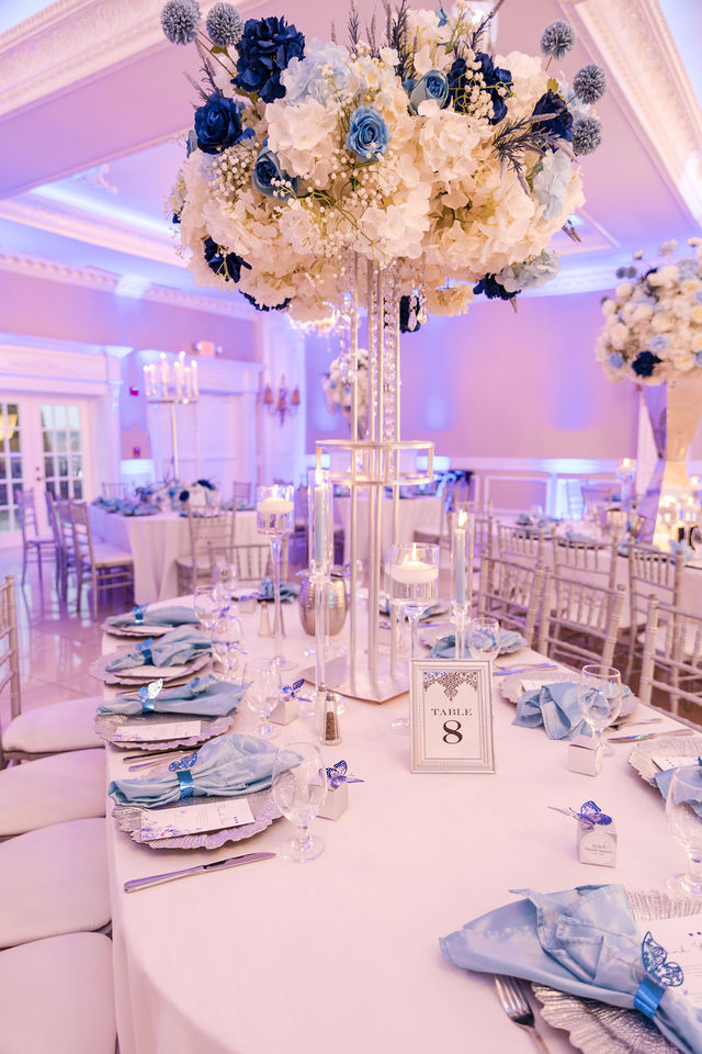 Sweet 16 blue and navy hydrangea and rose spherical centerpiece with butterflies by MJ Event Designs