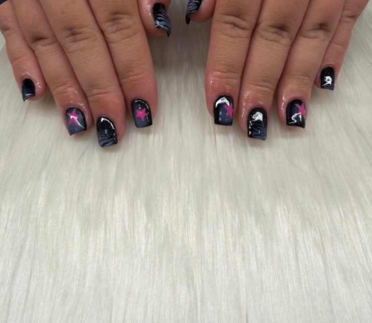 Short black square nails with pink stars, zebra lines and silver swirls