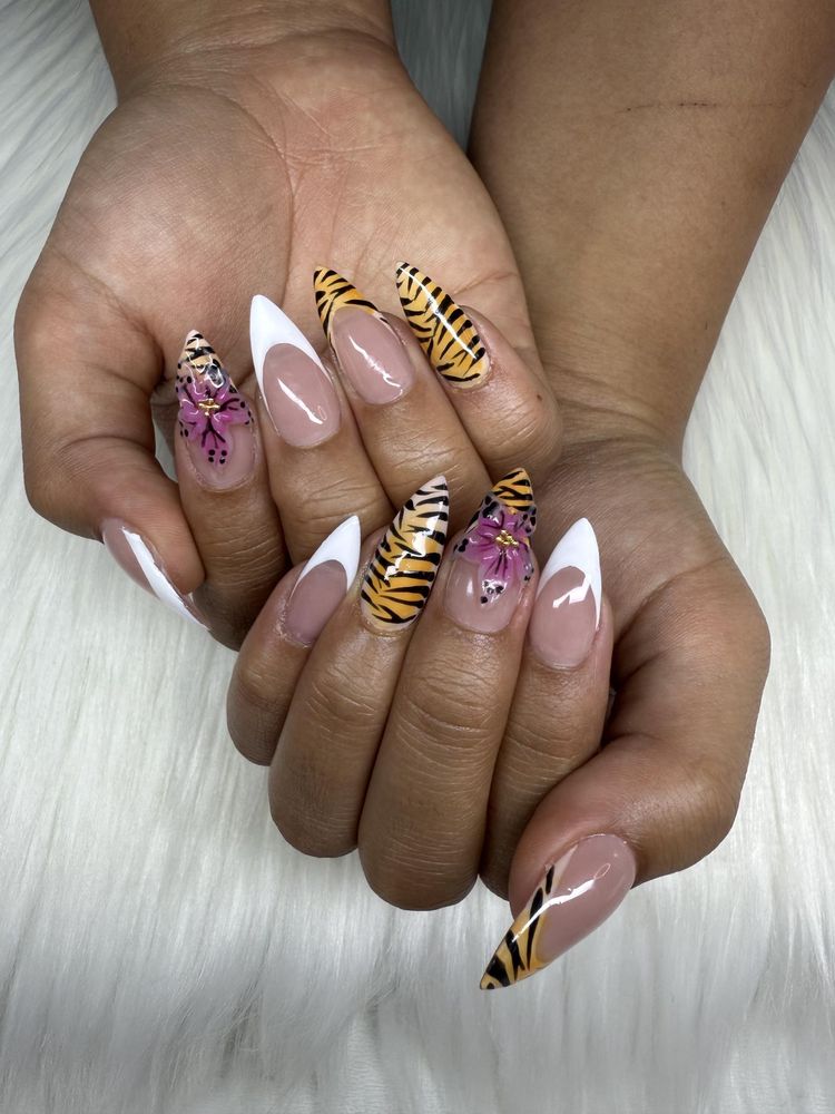 Stiletto nails with tiger stripe, pink floral art and white French tips