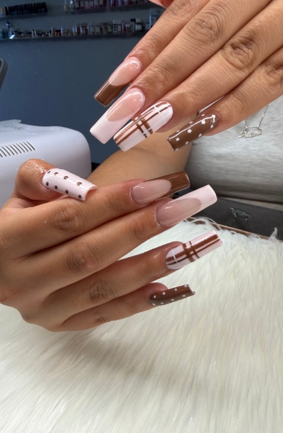 Long square acrylics with mocha French tips, plaid stripes and polka dots