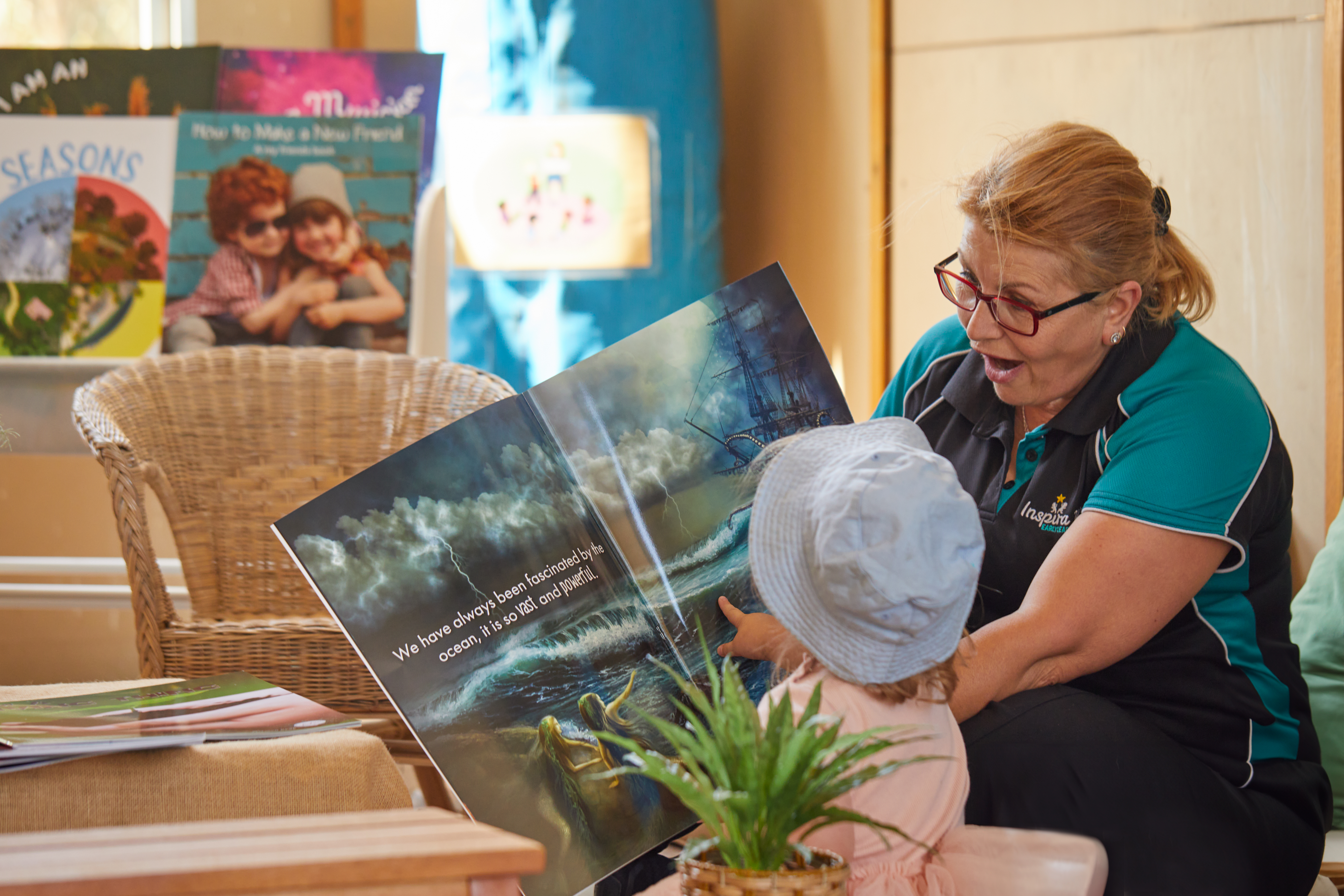 children reading stories with educators