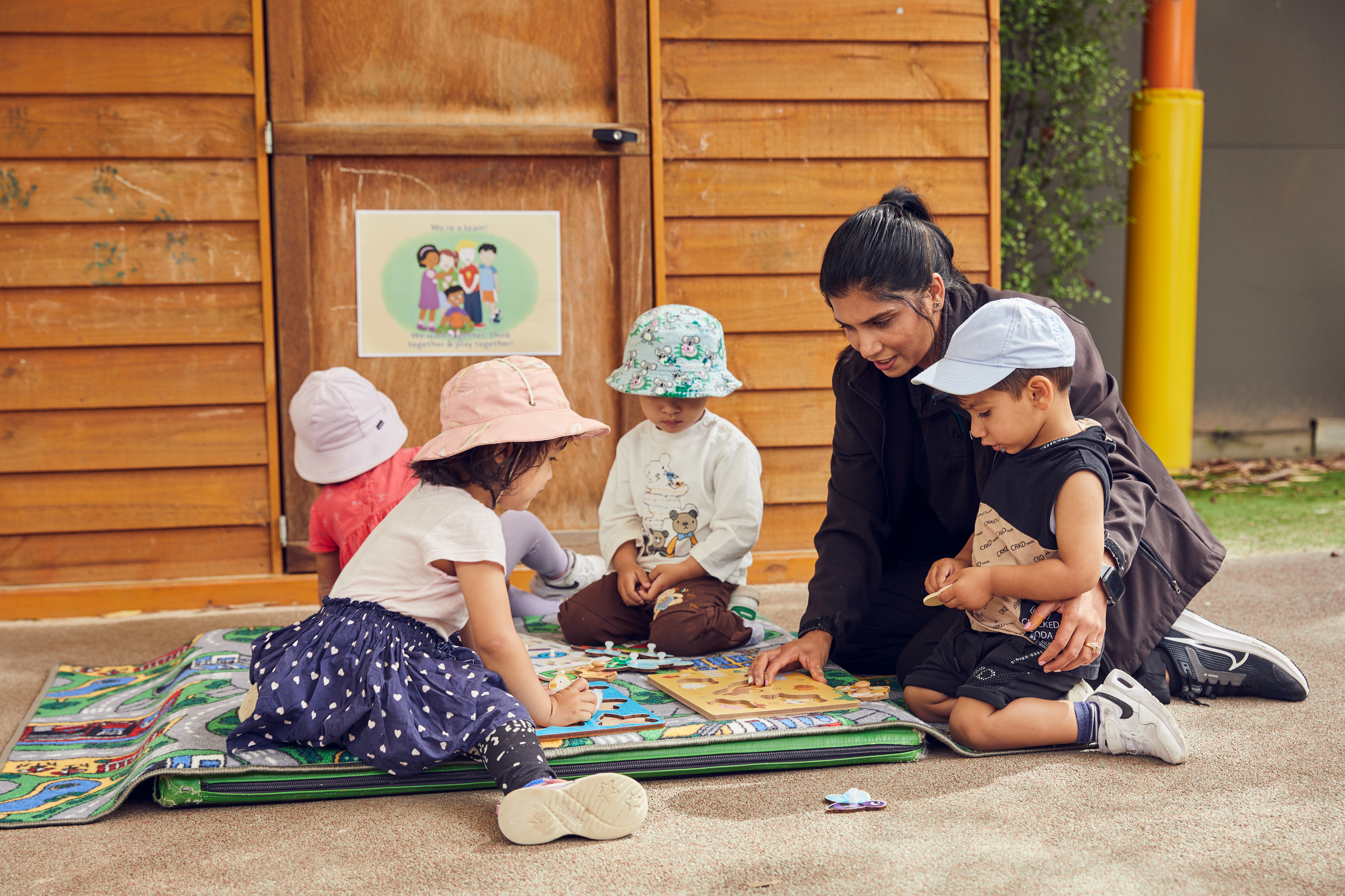 children playing with educators
