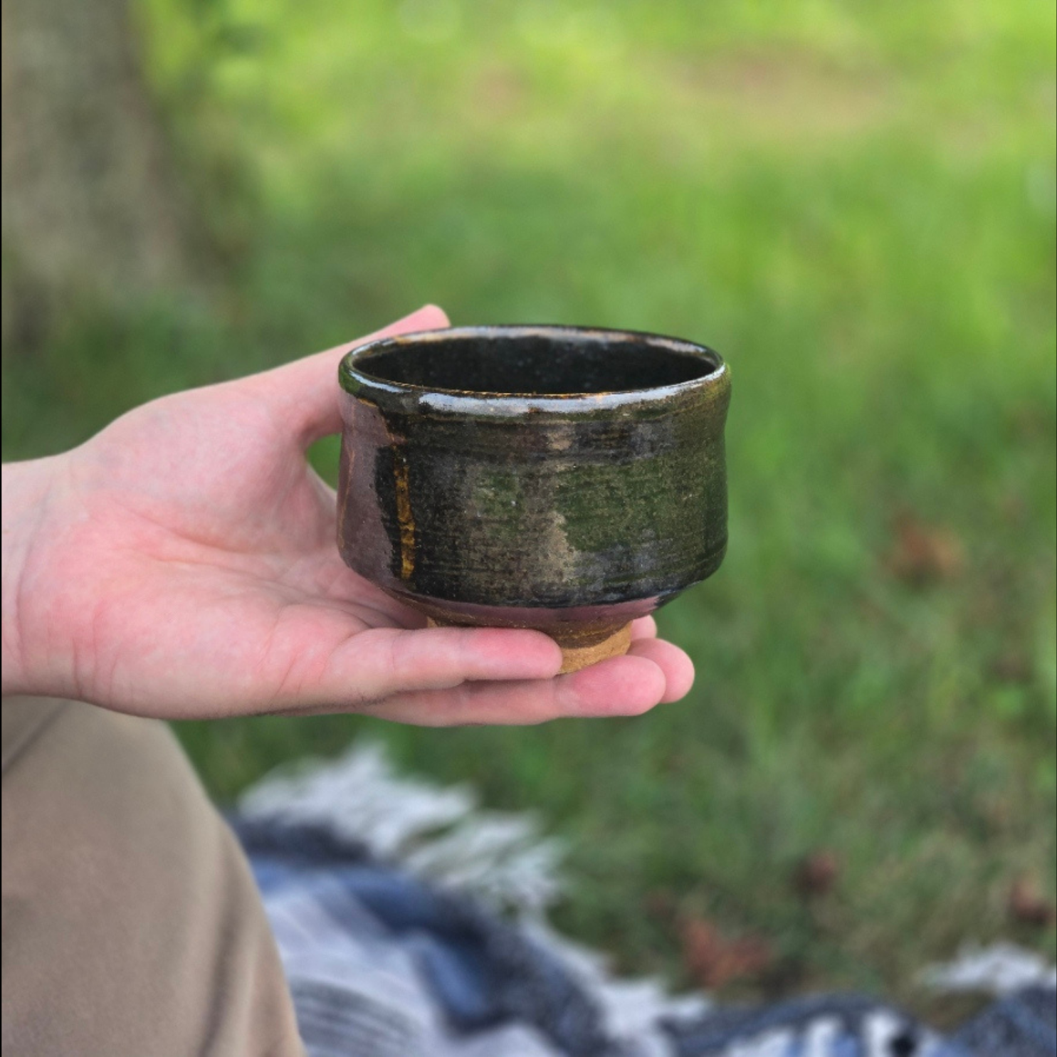 Japanese tea bowl held during a tea gathering