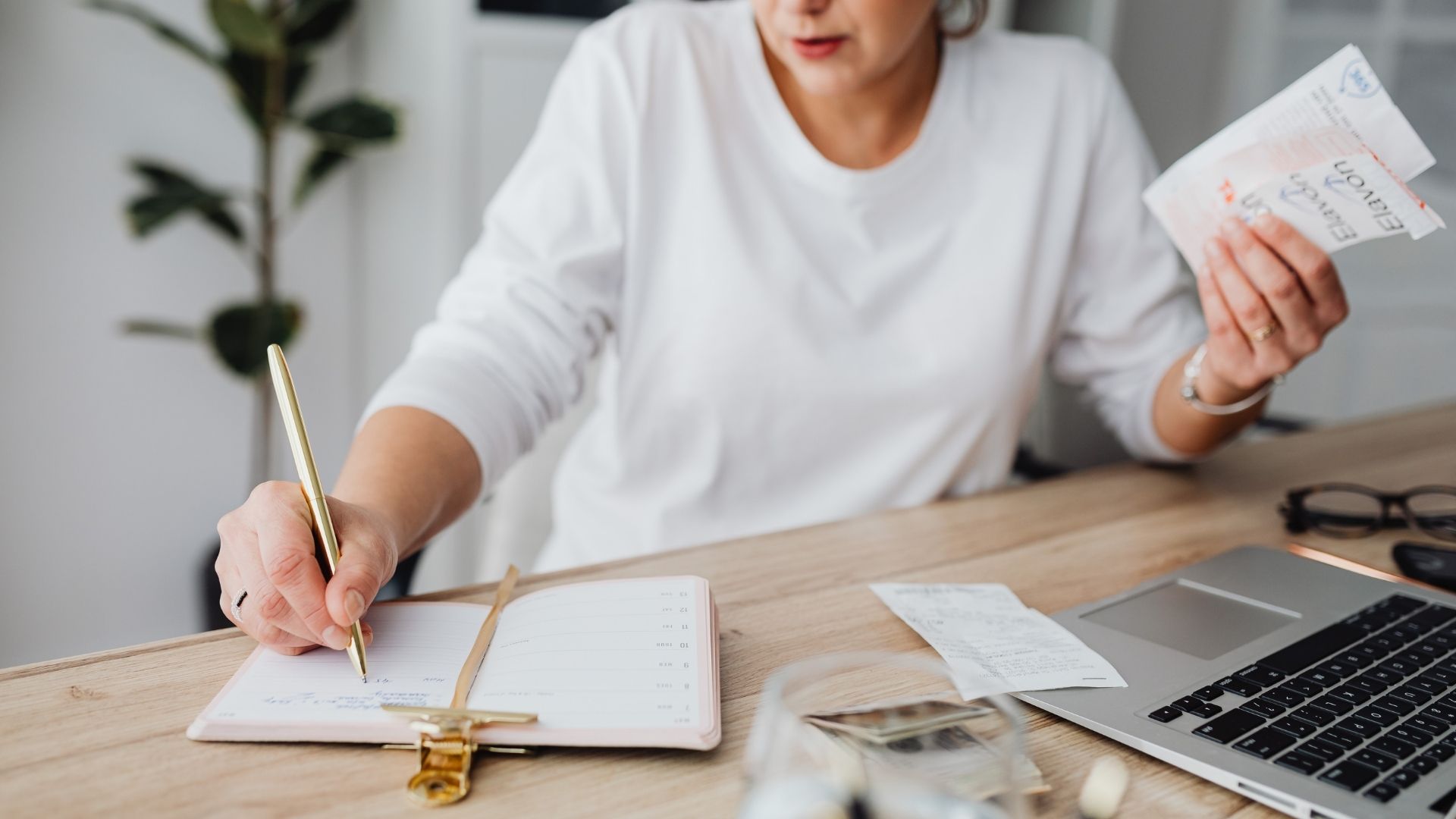 Therapist planning new practice at desk with notebook