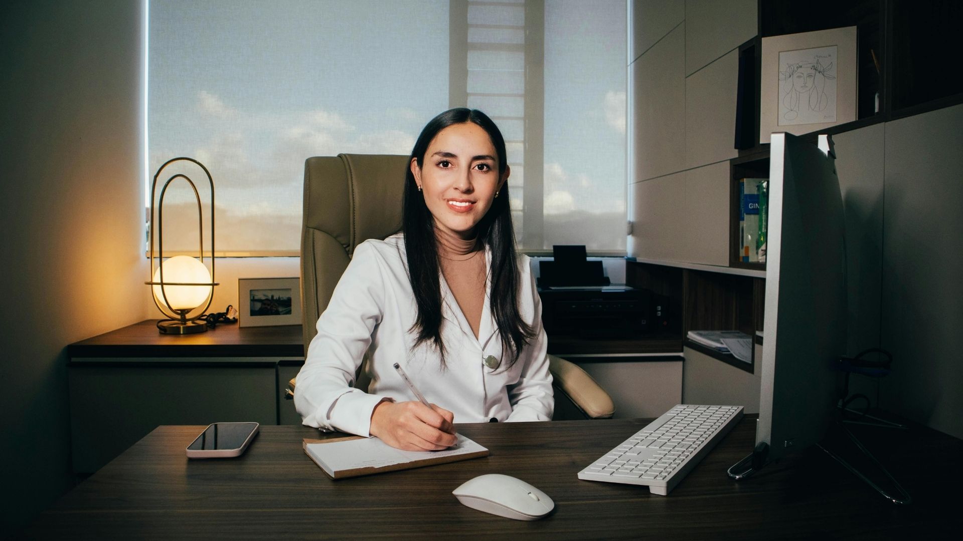 Therapist smiling in modern, organized office
