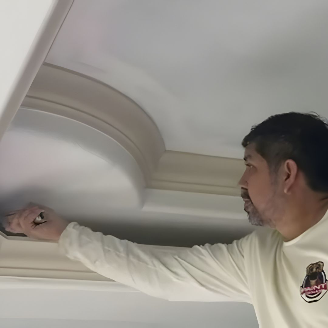 Painter caulking exterior fascia and soffit on Katy, TX home