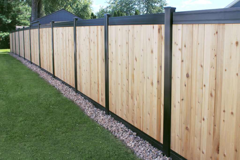 Modern wood privacy fence built with black metal structural posts in Grove City, OH.
