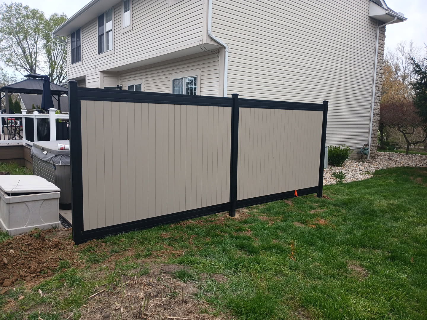 White vinyl privacy fence enclosing a backyard in Columbus, OH.