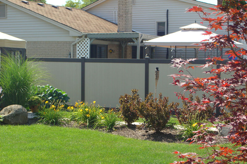 Solid white vinyl privacy fence installation in Lancaster, OH.