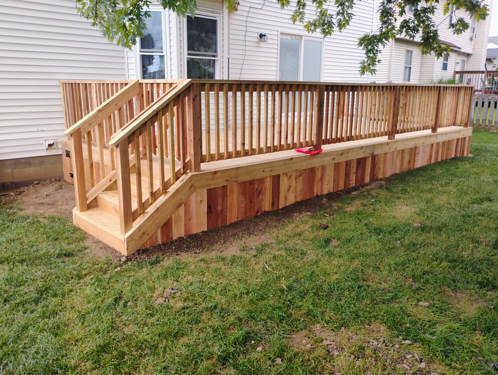 Multi-level backyard deck build with stairs in Pataskala, OH.