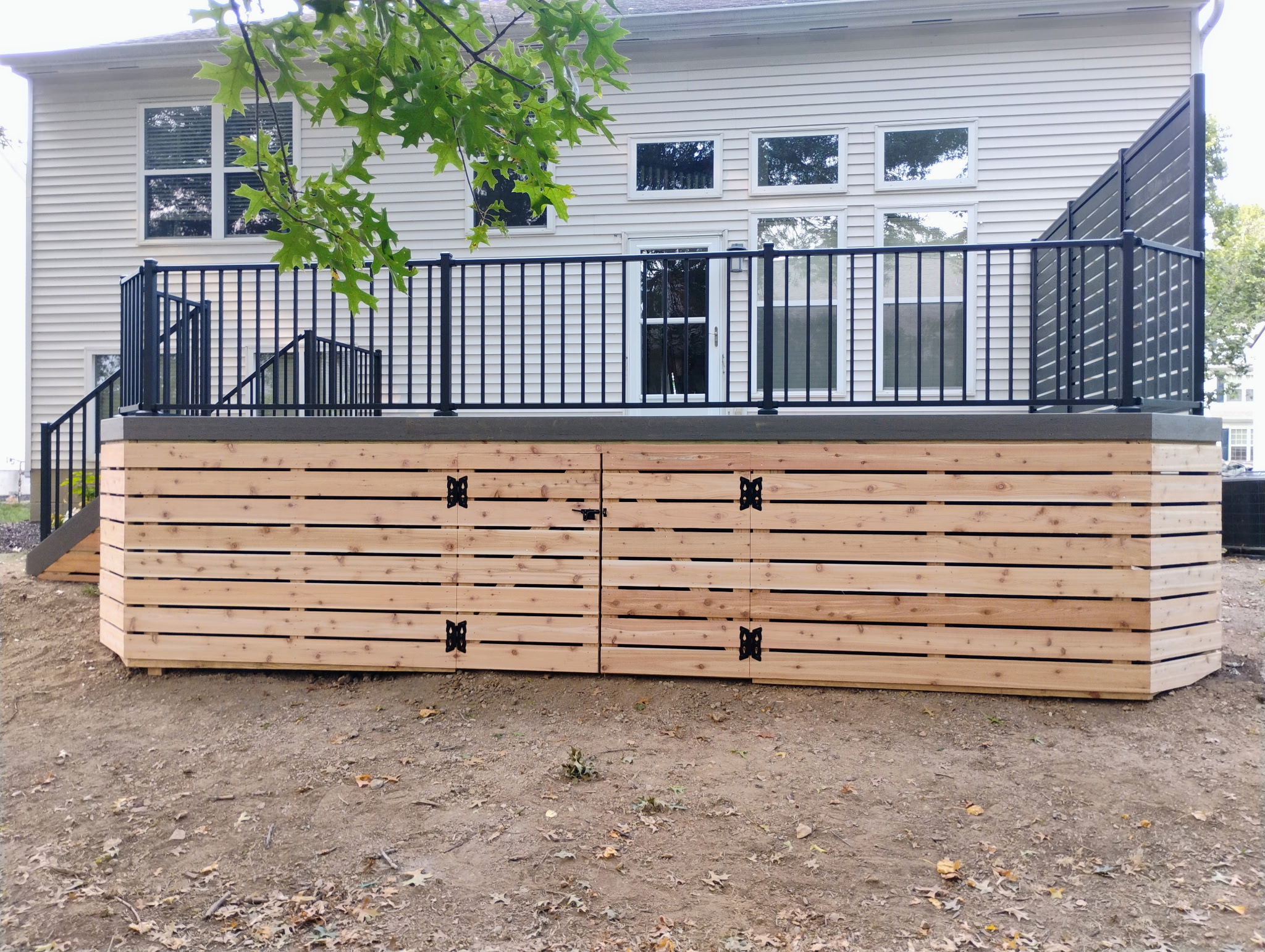 Custom deck build with integrated seating and railing in Worthington, OH.