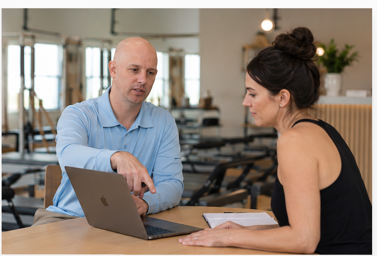Paul Roch working with a boutique fitness studio owner on financial clarity