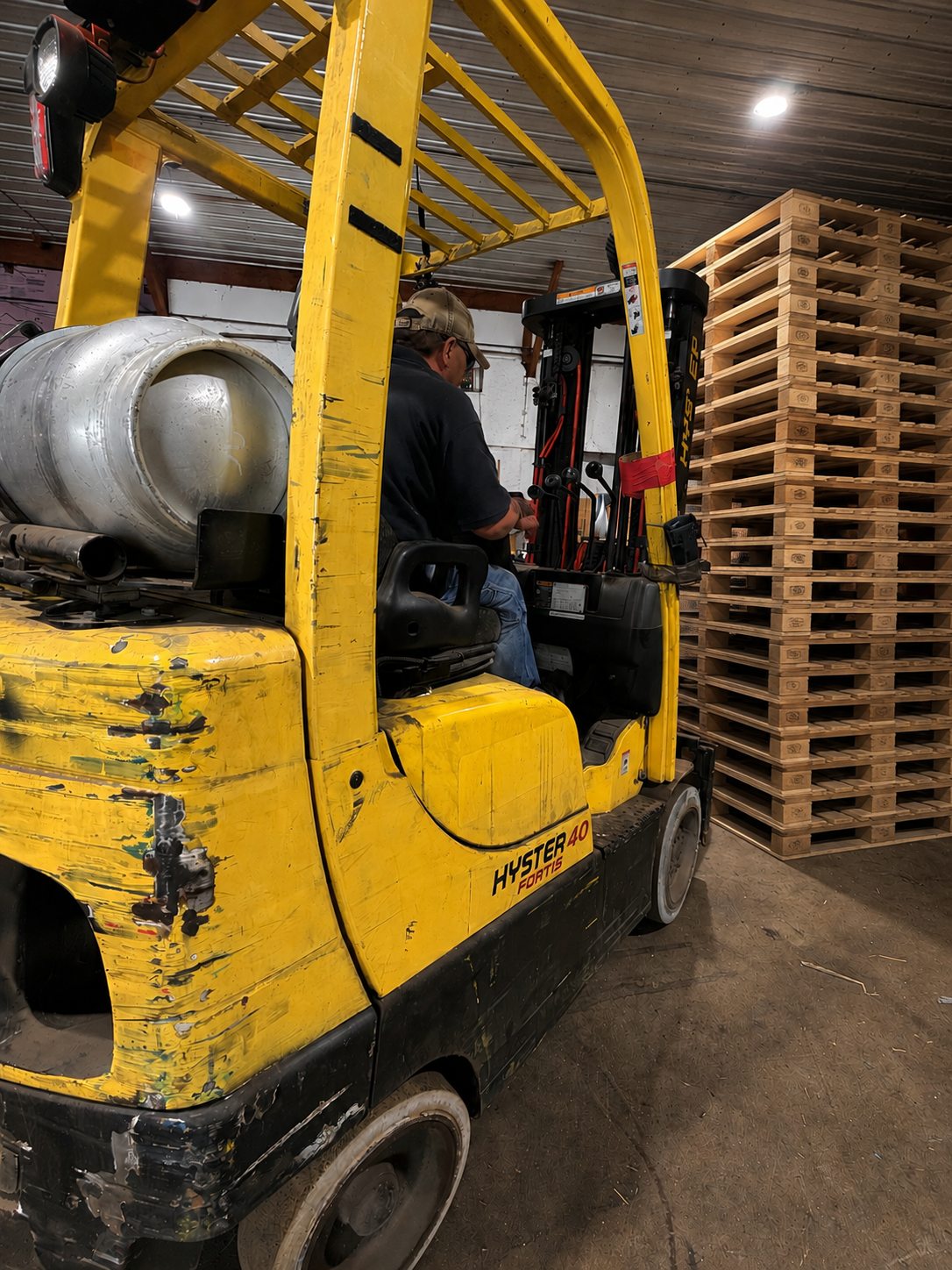 Forklift loading new pallets at Multi Pallets