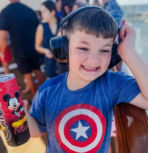 Caiden Smith, smiling and wearing headphones — the boy who started it all