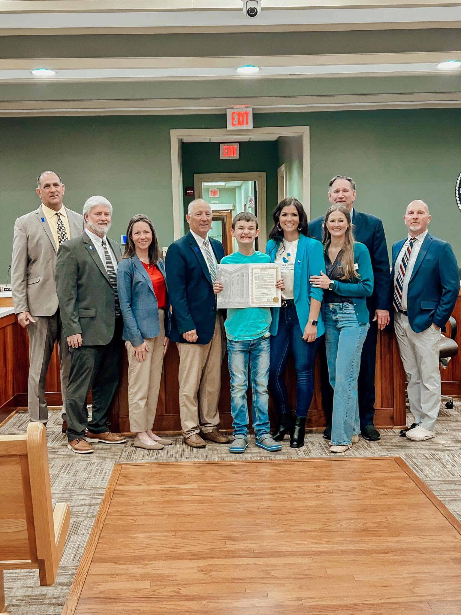Alyece Smith receiving proclamation from the Hancock County Board of Supervisors