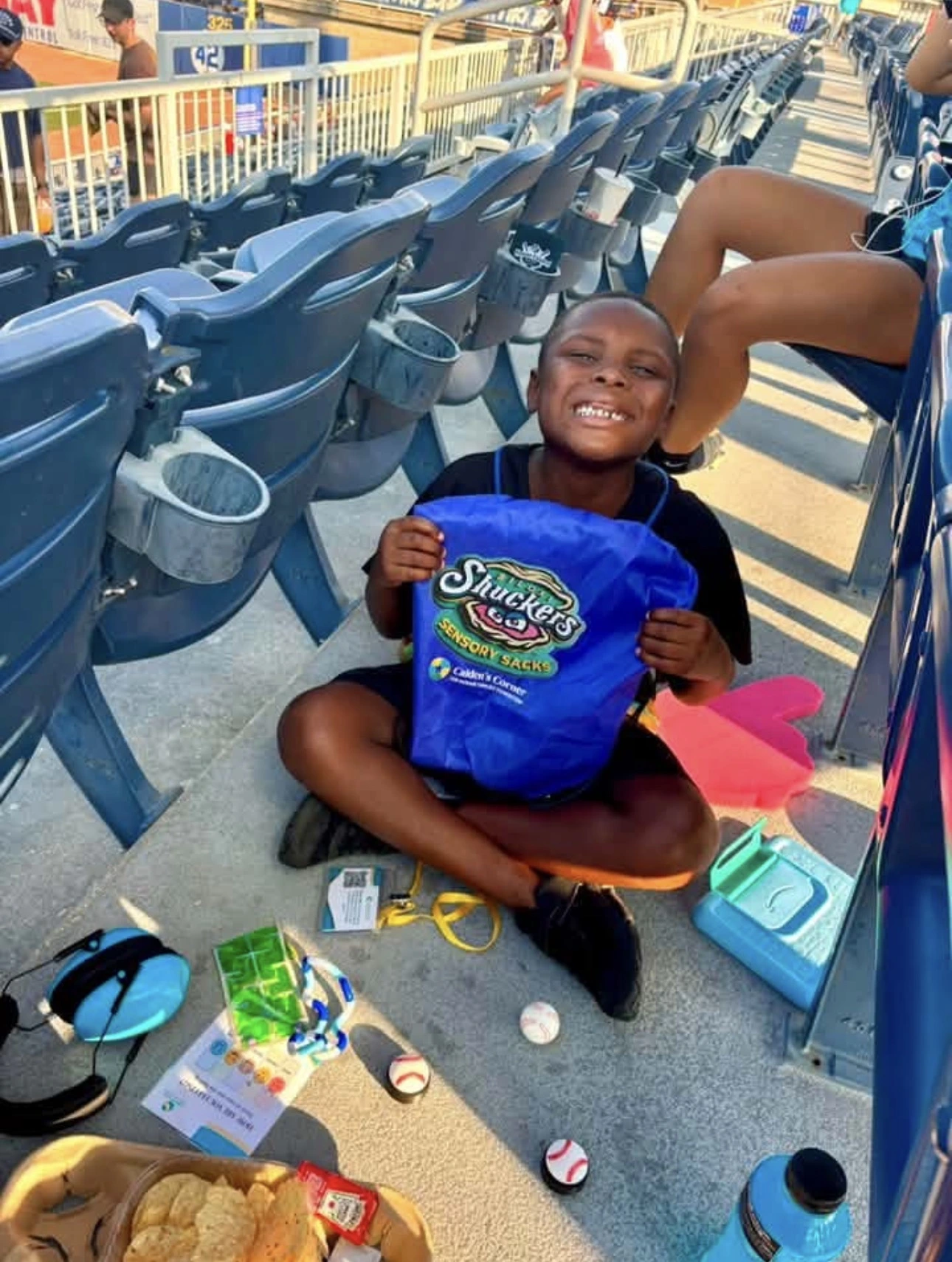 A kid using the sensory sack