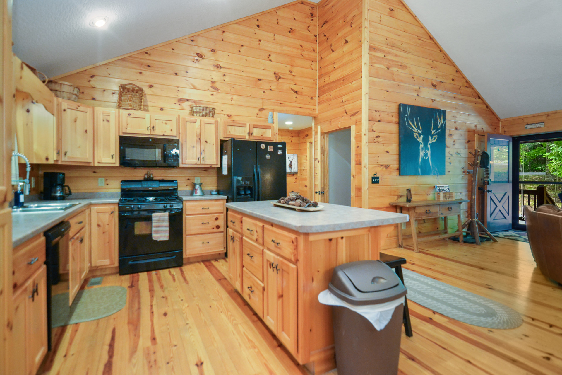 Fully equipped cabin kitchen with modern appliances and coffee station