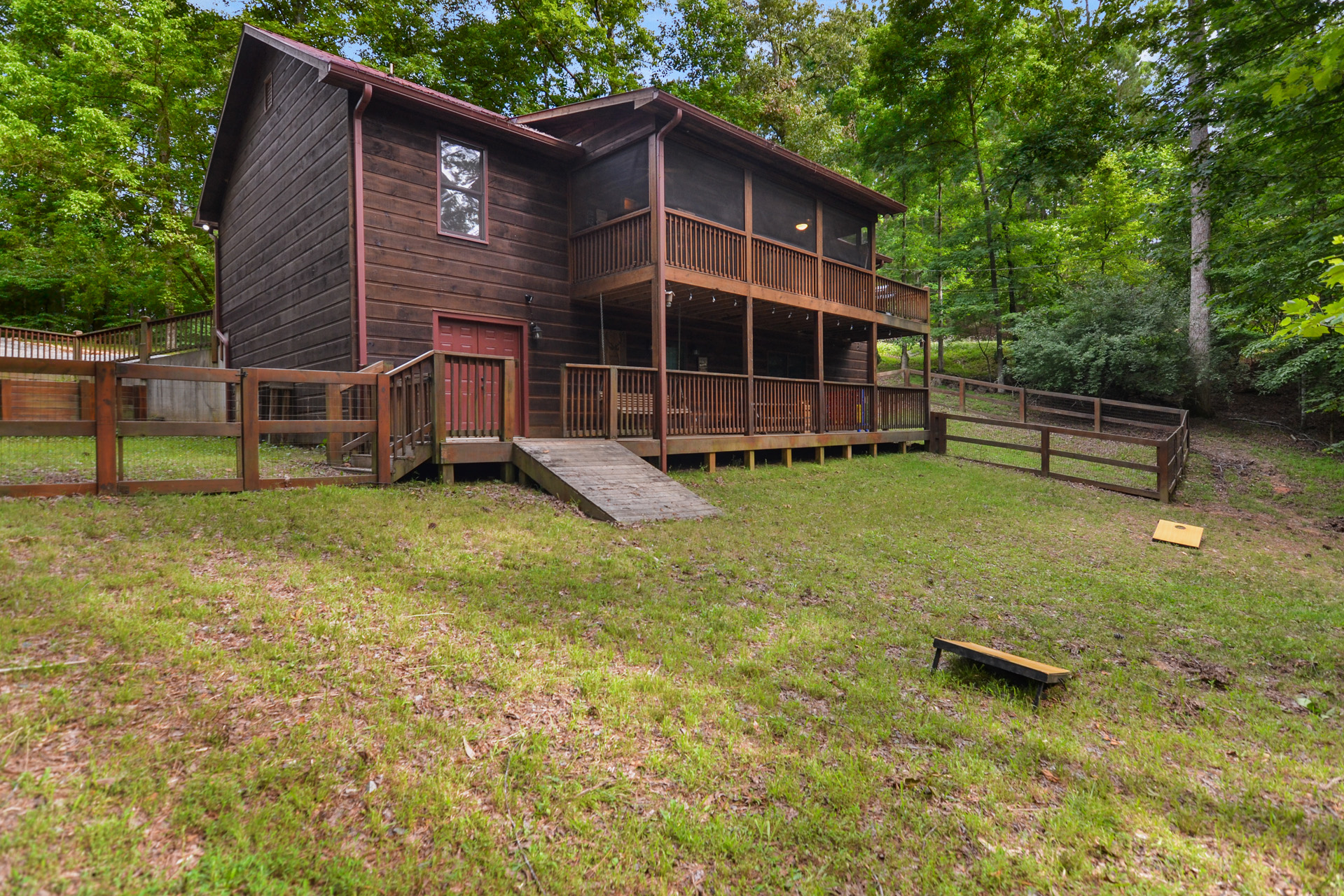 Multi-level decks and screened porch overlooking the mountain woods