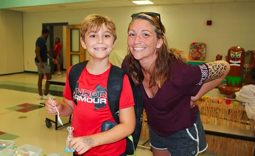 Child and teacher at a school event
