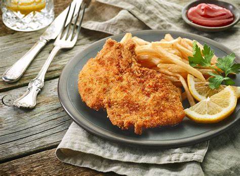 A warm view of authentic German dishes gathered on a wooden table at Zum Treffpunkt.